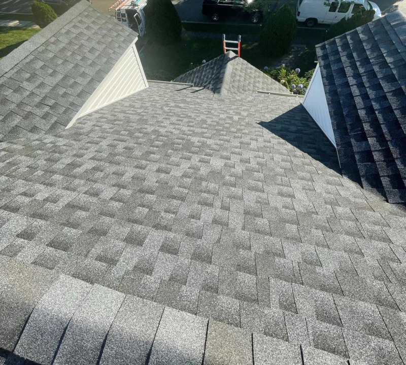 Completed grey architectural shingle roof on a Long Island home