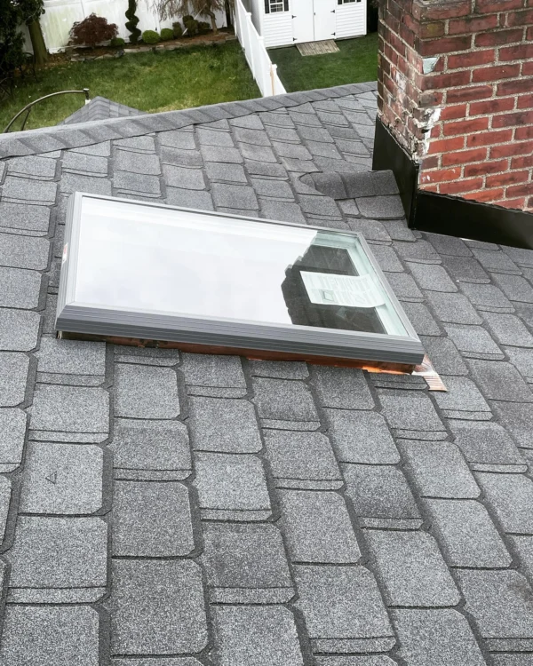 New shingle roof with properly flashed skylights